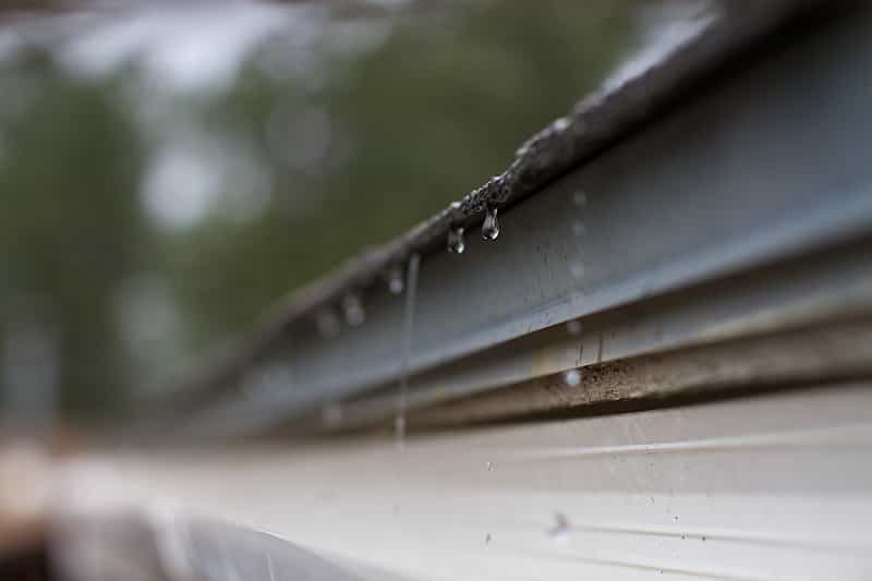 Rain falling on gutters.